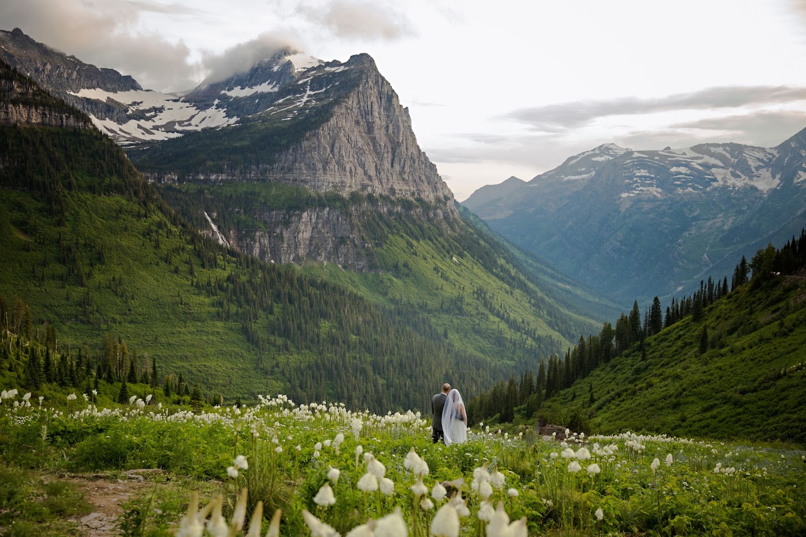 wedding couple looking at mountain view